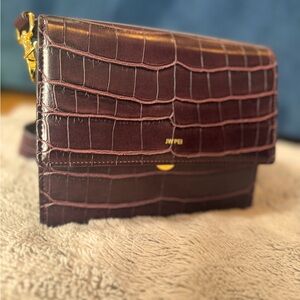 Used like new jw pei in burgundy